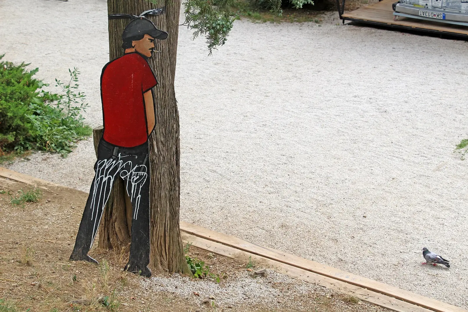 Painted human figure attached to a tree at Zagreb Art Park in 2018