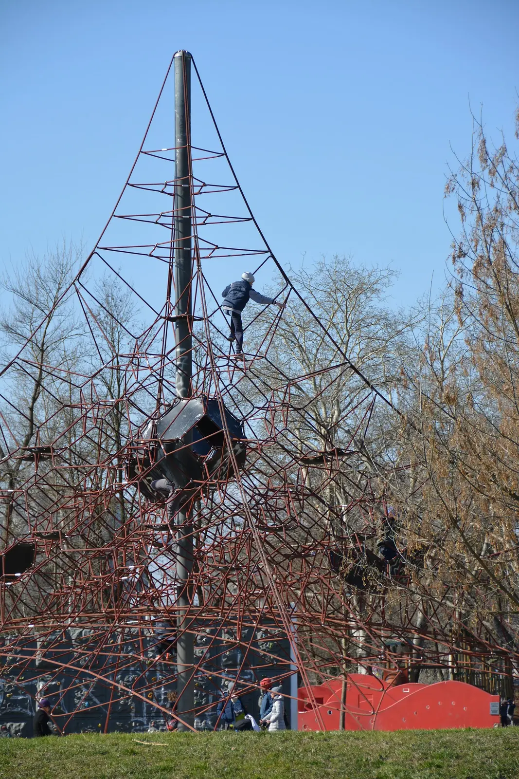 Tall outdoor climbing frame among bare trees at Bundek Park