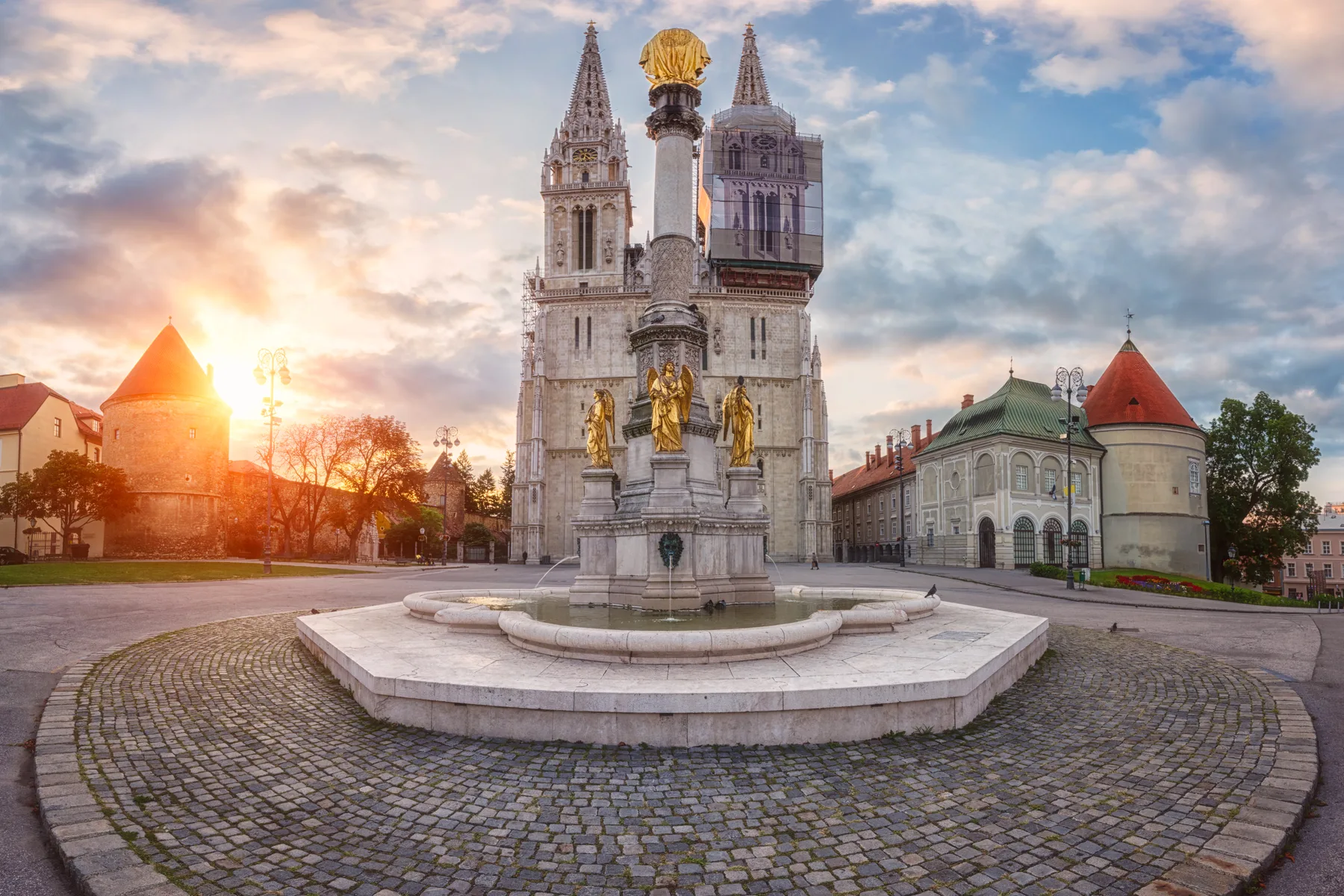 Zagreb Cathedral and Holy Mary monument at sunrise before the 2020 earthquake