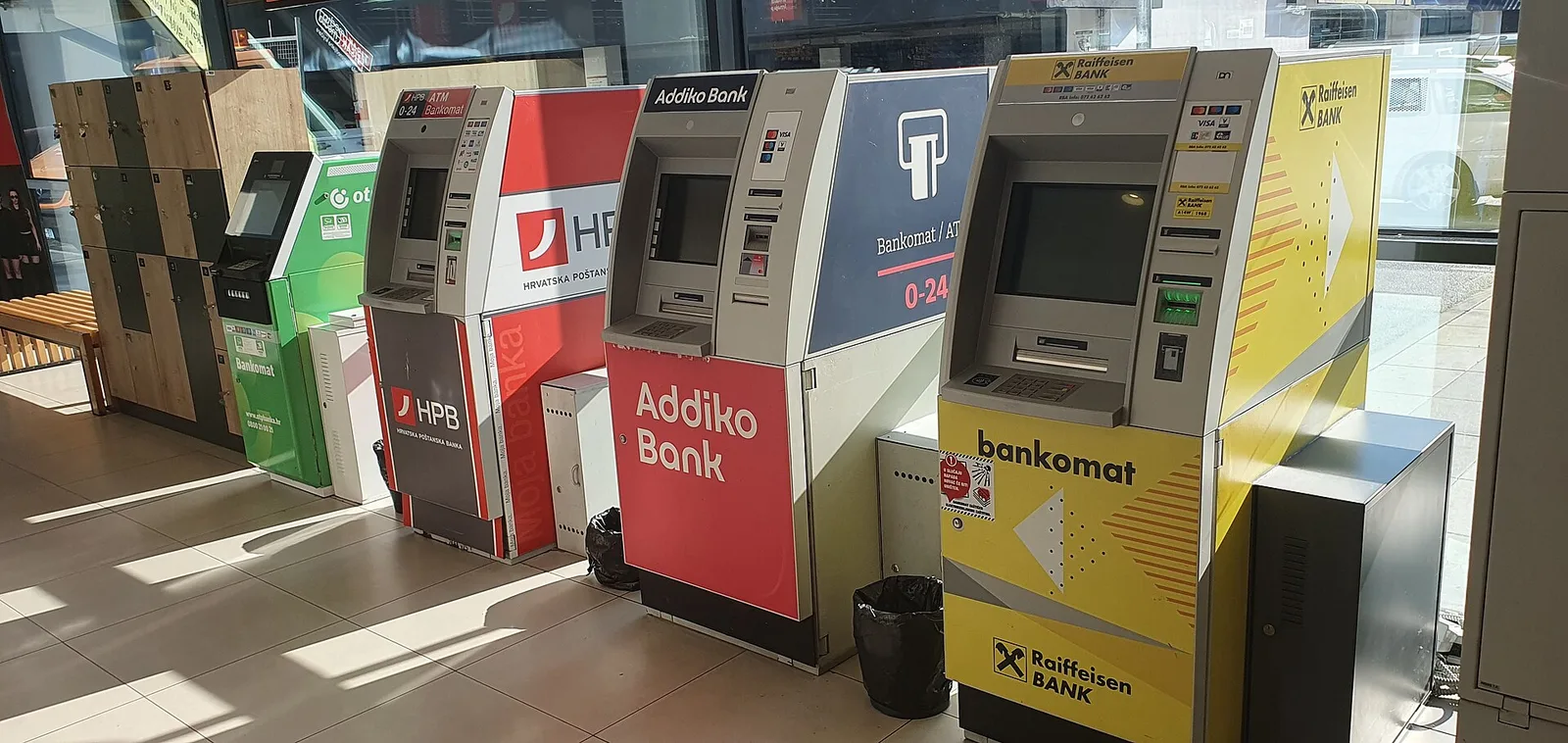 Bank-operated and independent cash machines standing side by side in Croatia