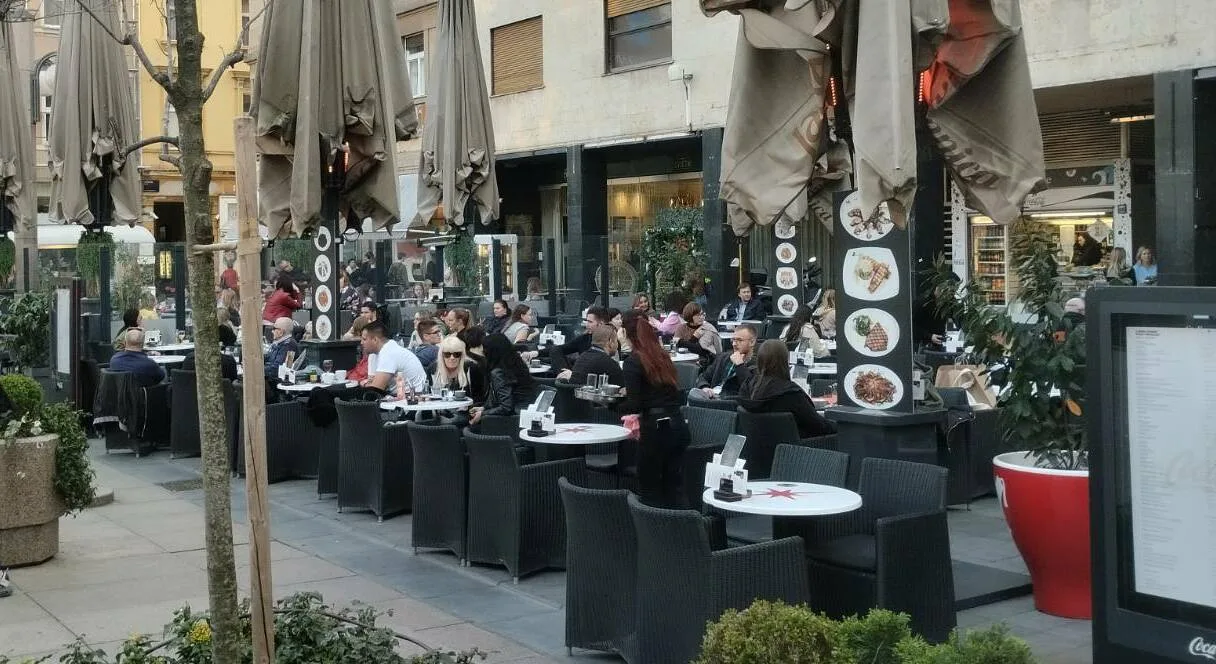 Busy café terraces with tightly arranged tables on Cvjetni Square