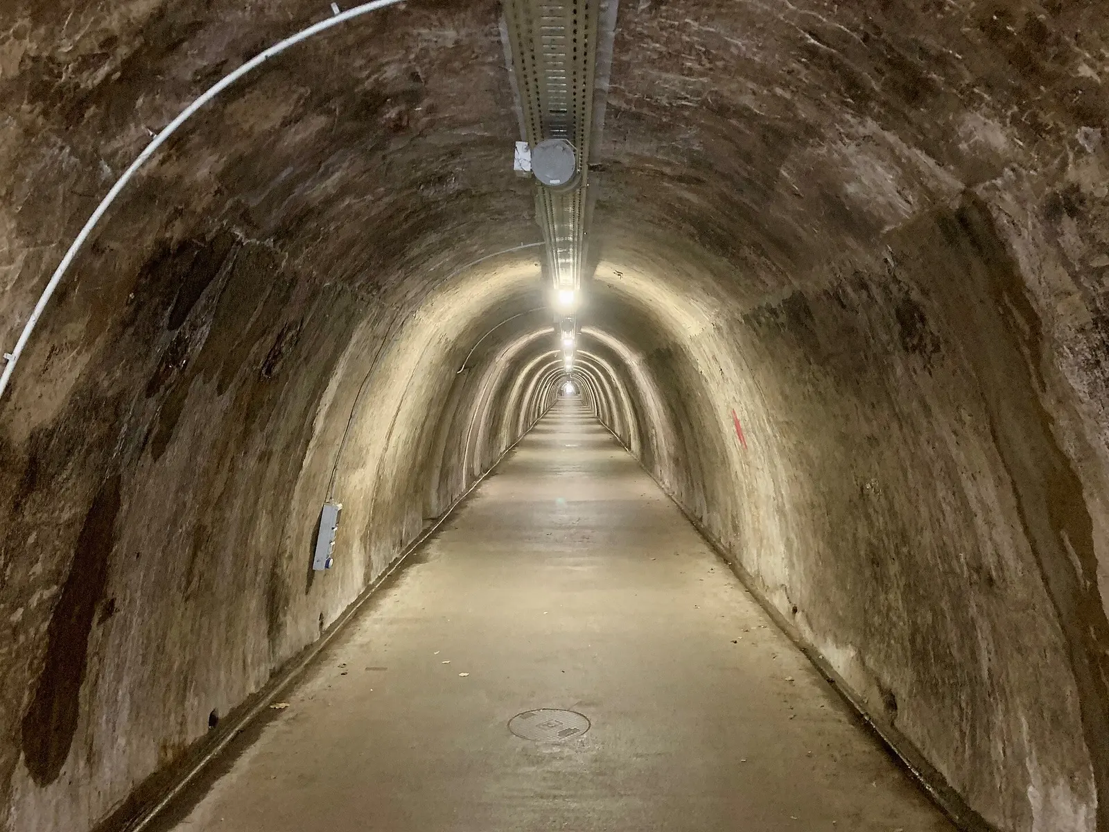 Broad illuminated barrel passage inside Grič Tunnel Zagreb in 2024
