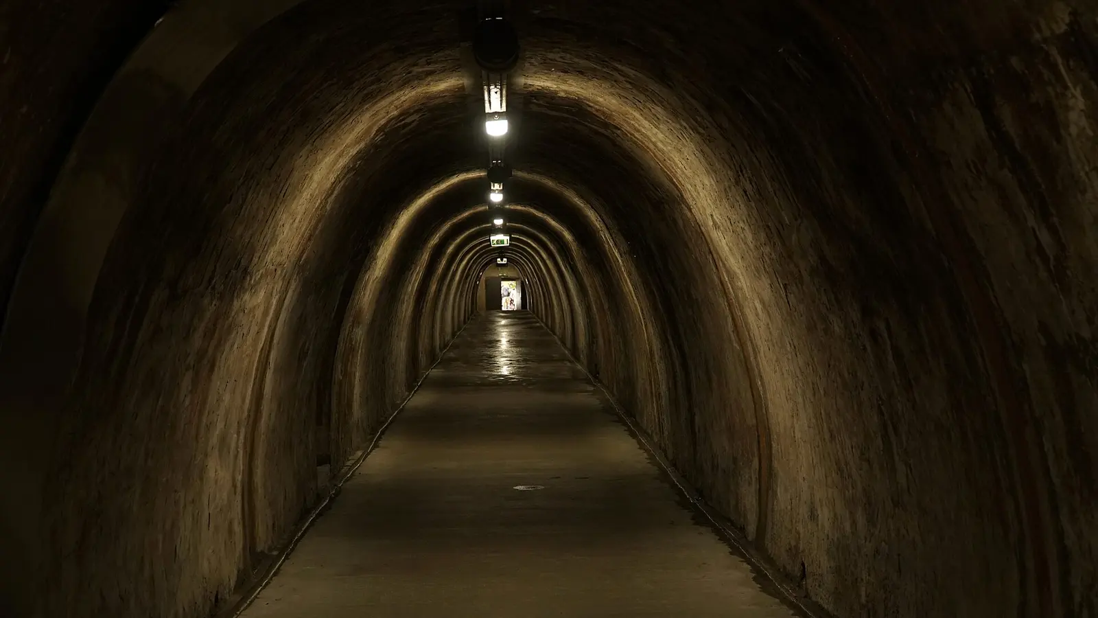 Opposite Grič Tunnel passage with continuous ceiling lights