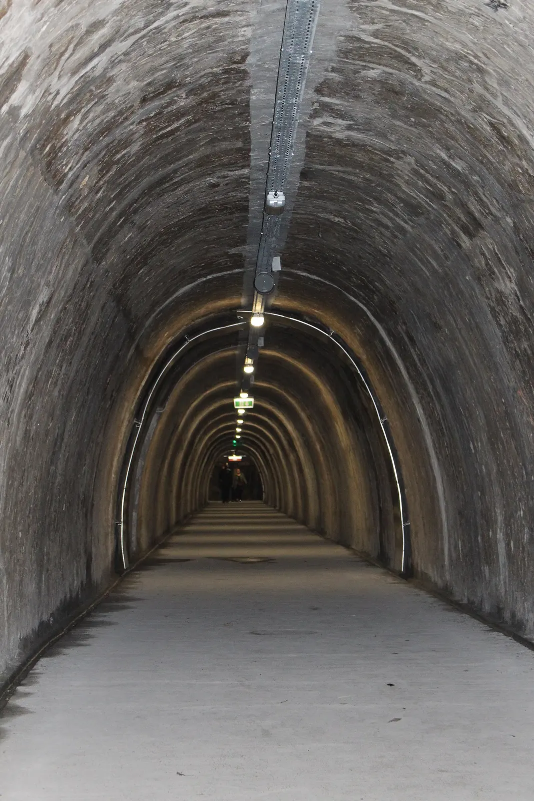 Narrow portrait view through the arched Grič Tunnel in Zagreb