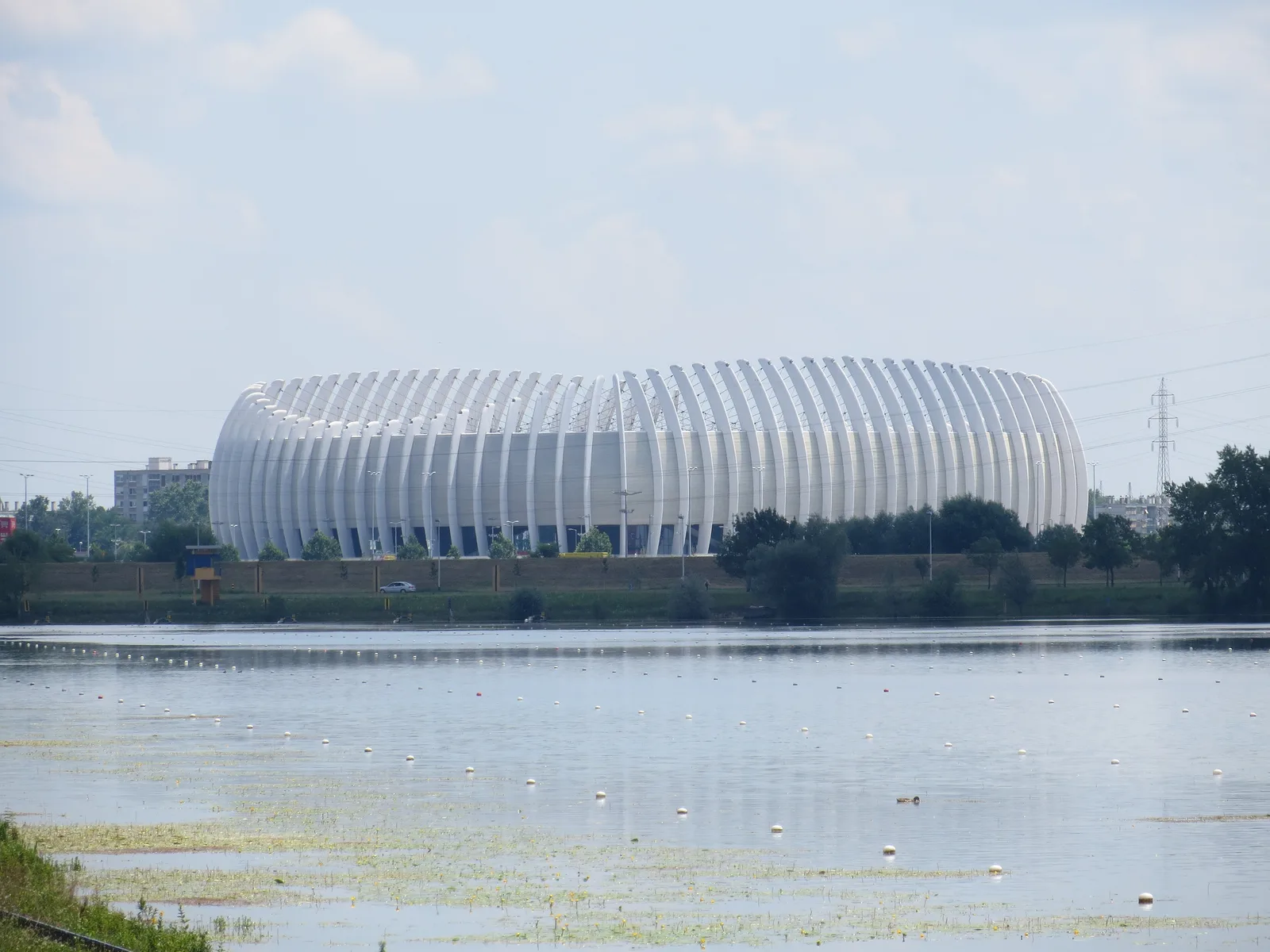 Arena Zagreb seen across the water and reeds of Jarun Lake