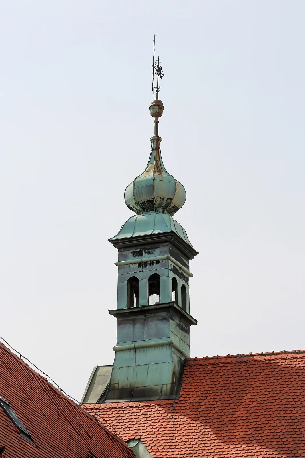 Historic church tower rising above the roof of Klovicevi Dvori Gallery
