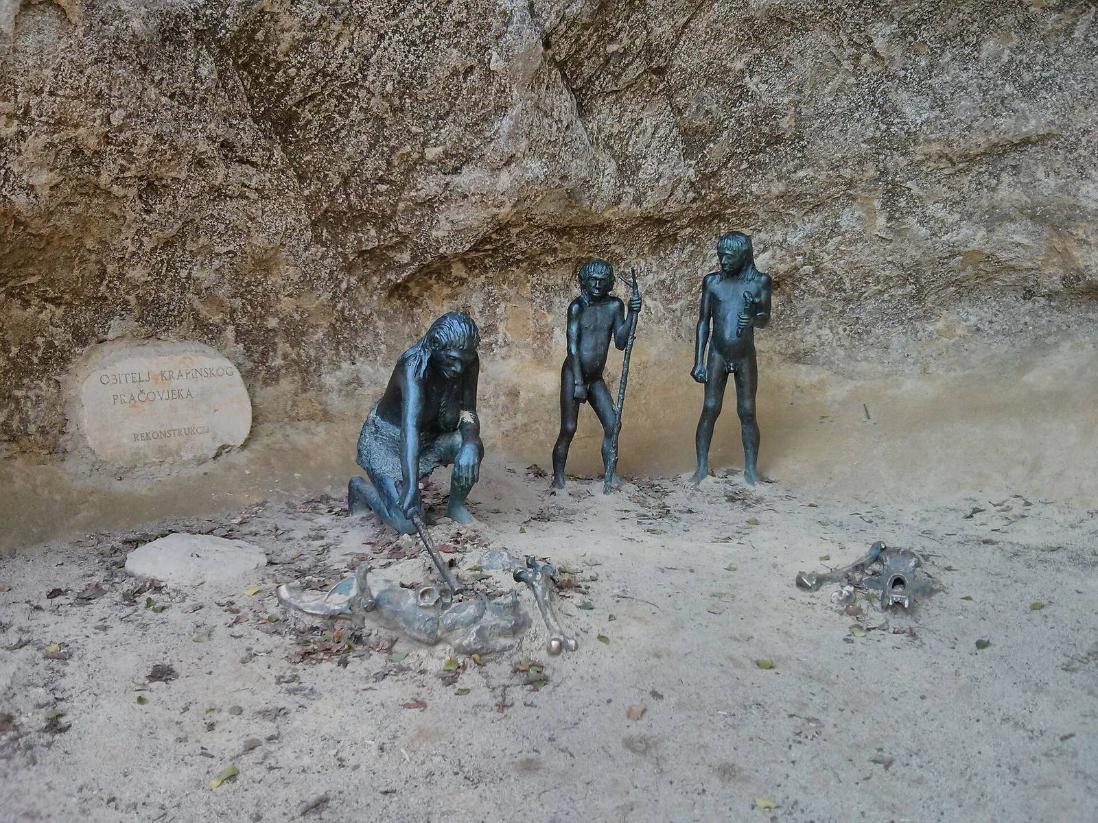 Reconstruction figures arranged against the rock face at Hušnjakovo in Krapina