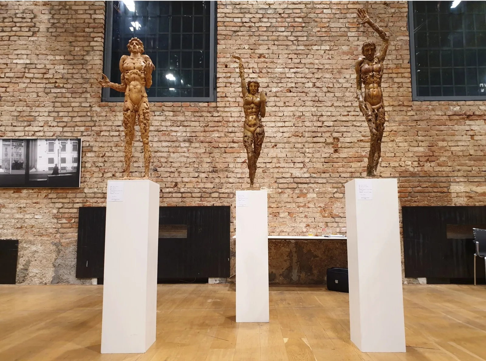 Contemporary sculptures displayed against Lauba's exposed brick interior during a 2019 art fair