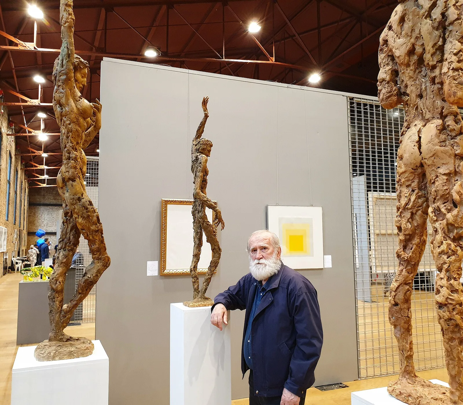 Sculptures and an artist inside Lauba during a Zagreb art fair