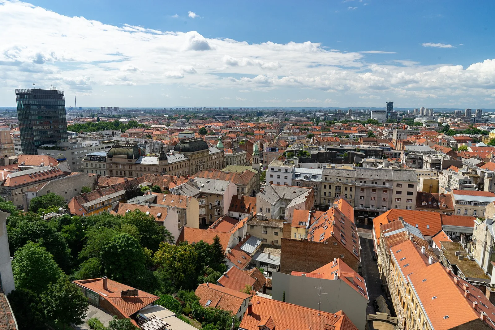 Wide Zagreb city view from Lotrscak Tower across red roofs to Novi Zagreb