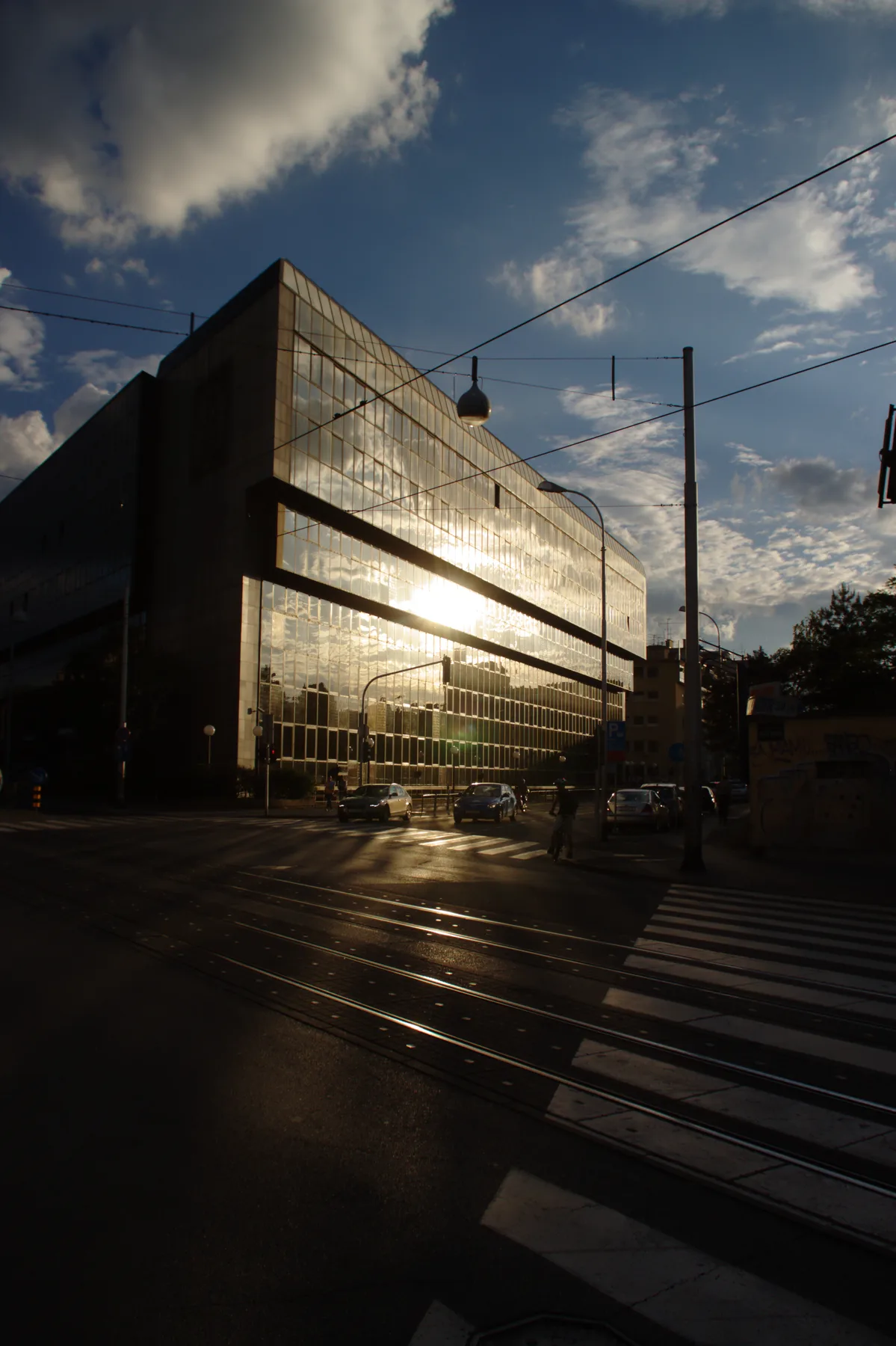 Modern gallery building and tram corridor on Martićeva after rain