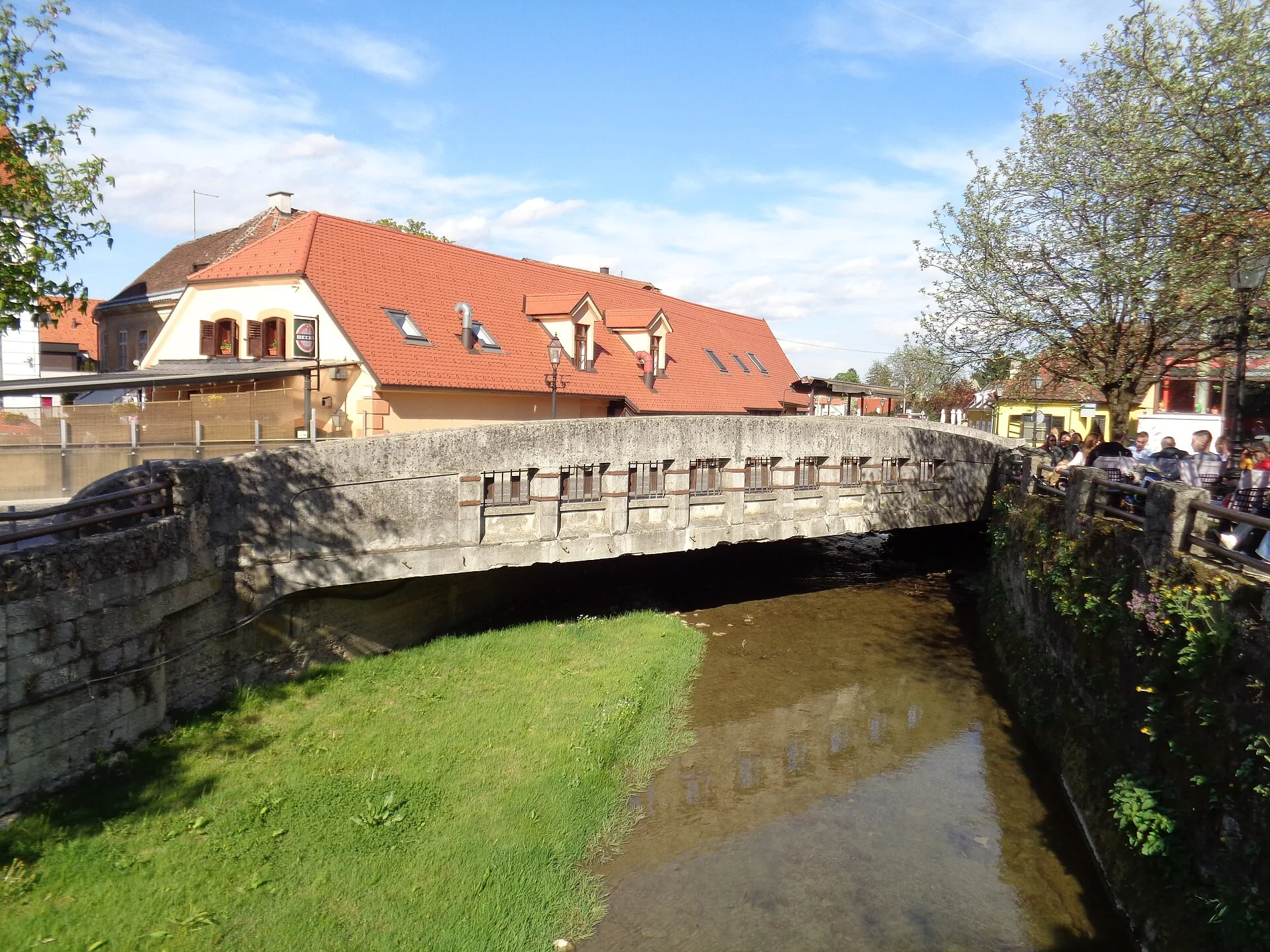 A stone bridge crossing the shallow Gradna stream in central Samobor