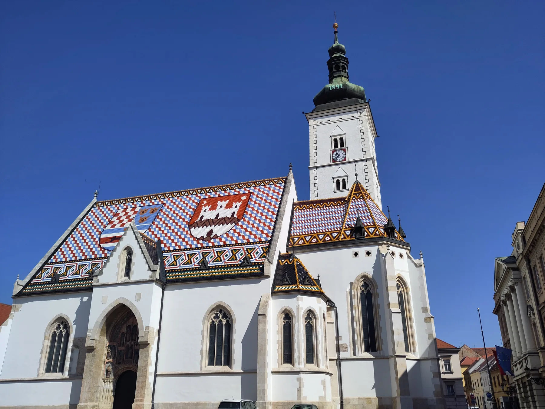 South exterior of St Mark's Church with tiled roof, portal and bell tower