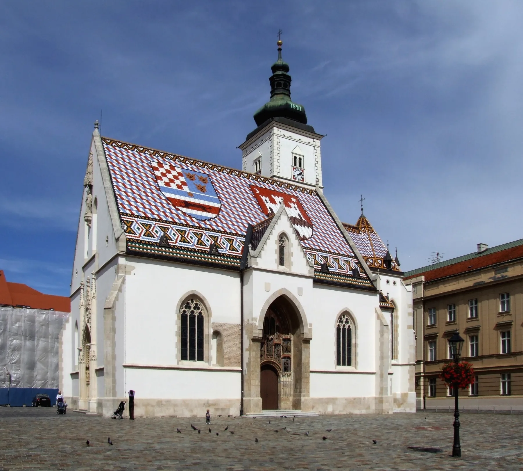 Wide view of St Mark's Church standing within the paved civic square