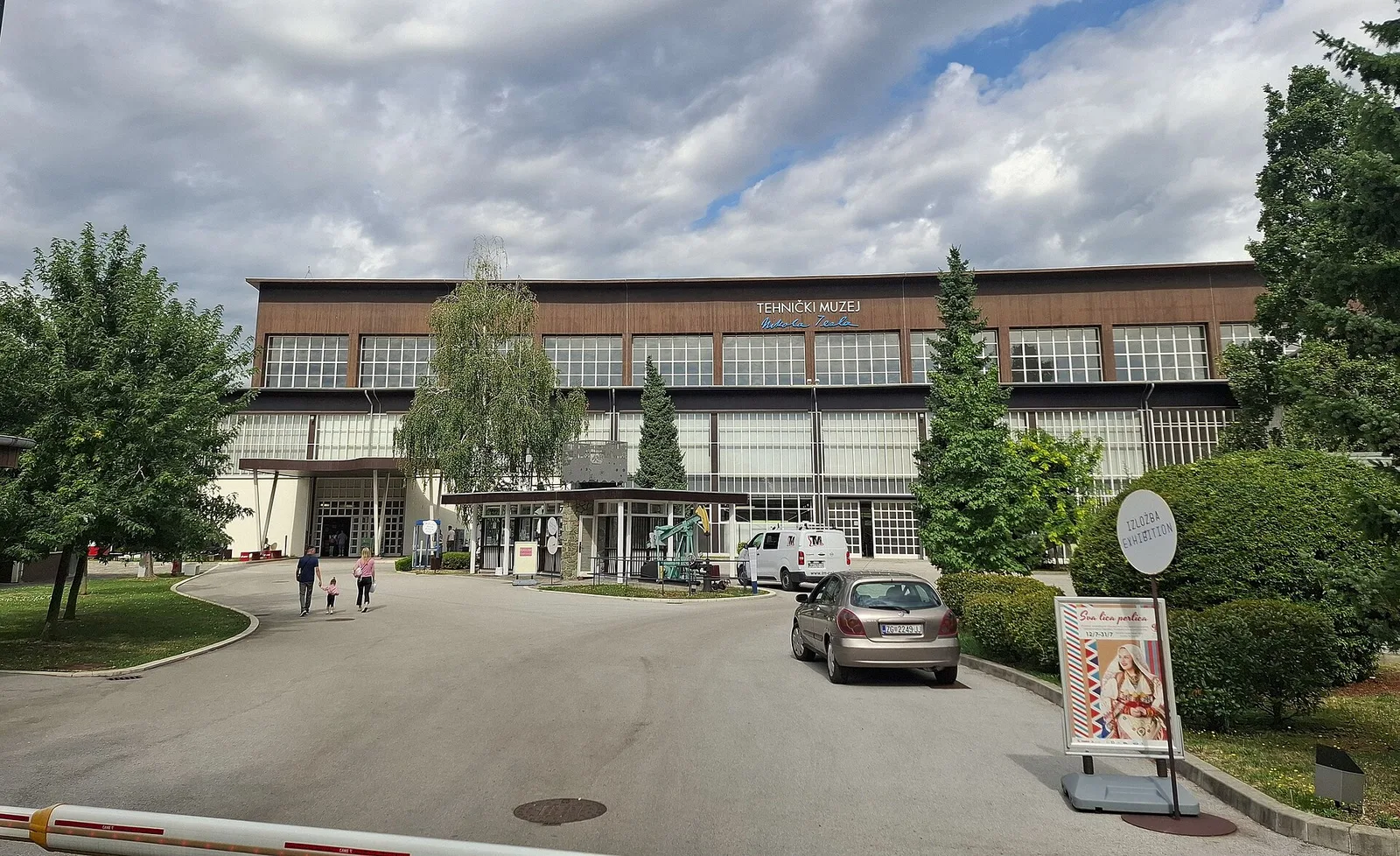 Main entrance and long modernist facade of Technical Museum Nikola Tesla in 2025