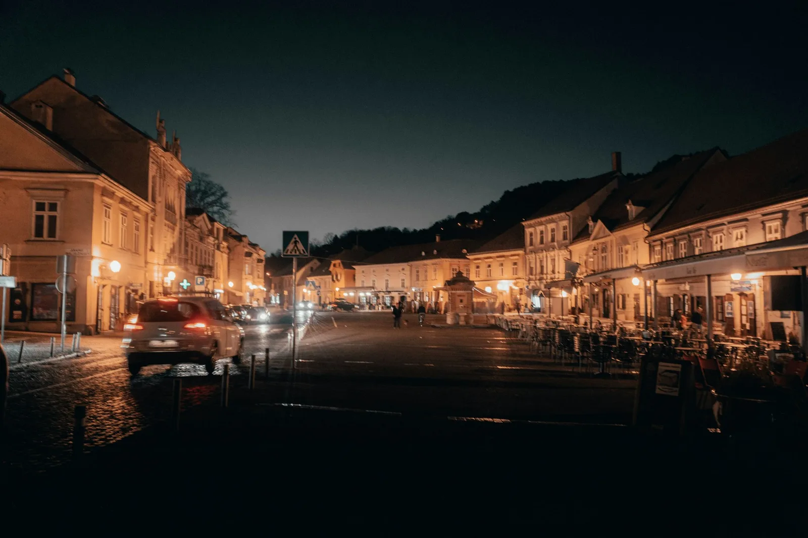 A warmly lit Zagreb street at night